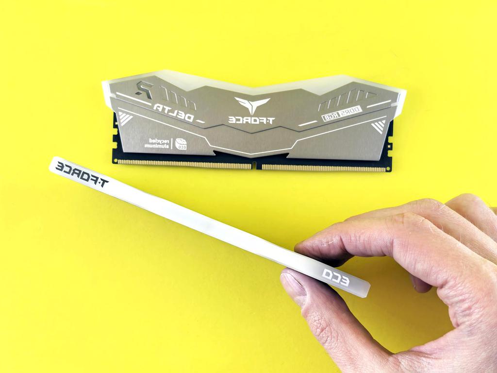 Modern DDR5 RAM stick angled with shiny circuits