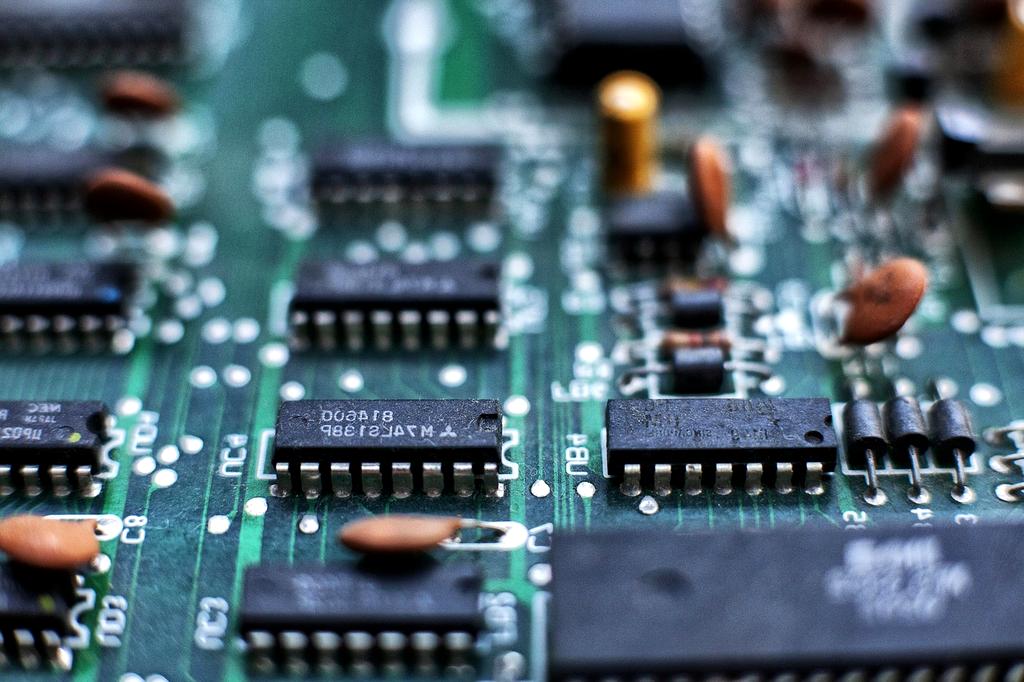 Microscopic view of quantum chip showing individual qubit arrays and control circuits